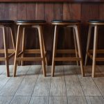 Row,Of,Wooden,Chairs,Or,Stools,Vintage,In,Front,Of